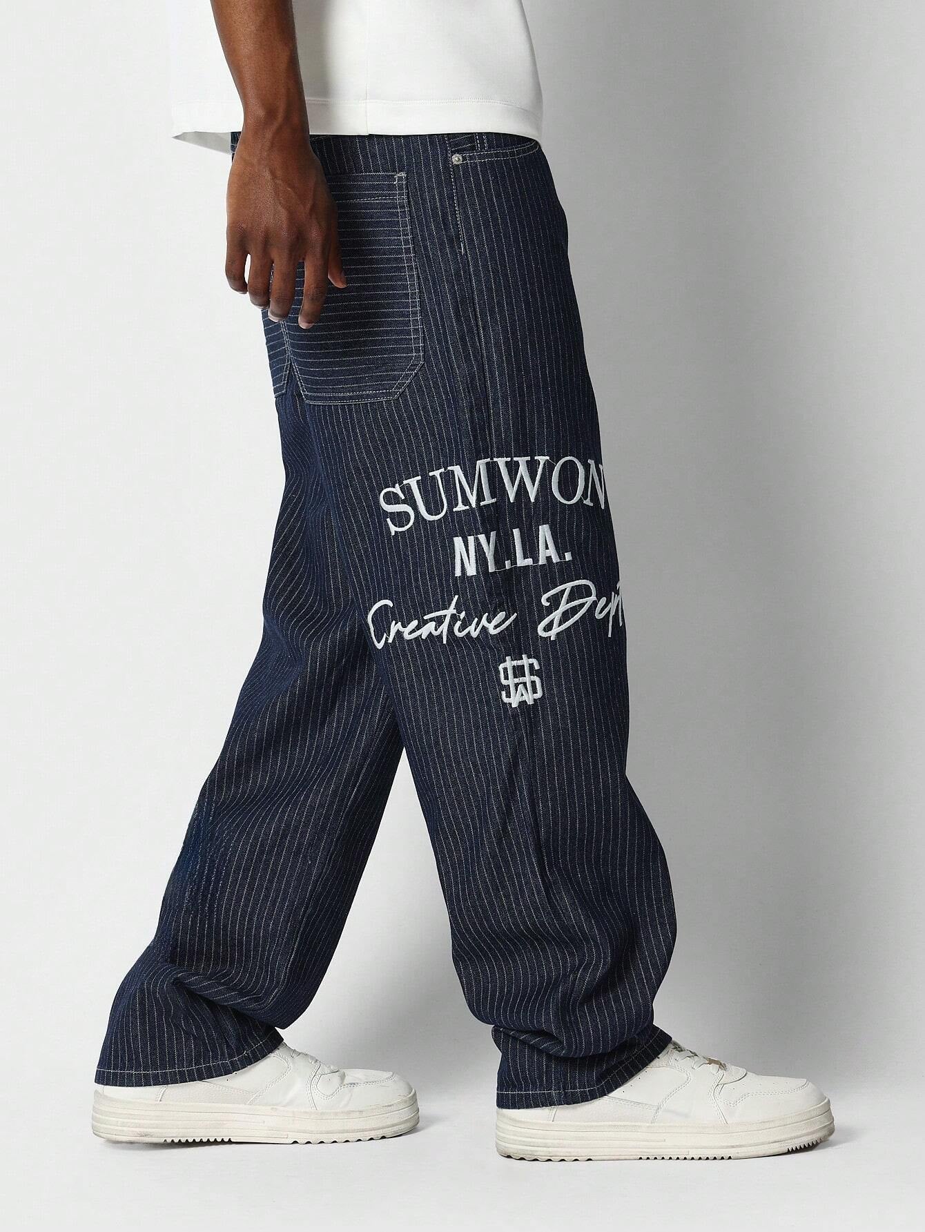 Calça Denim reta com bordado